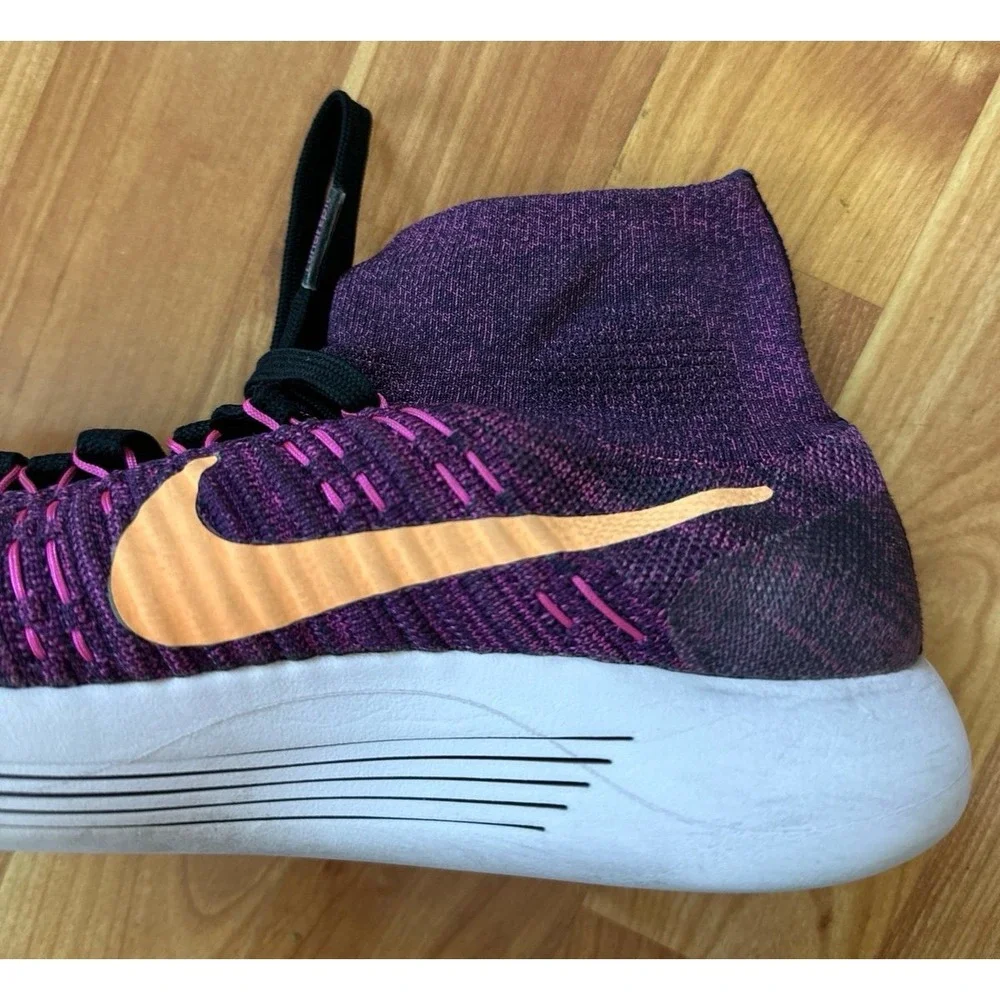 Nike LunarEpic Flyknit running shoes in a purple colorway with an orange swoosh.